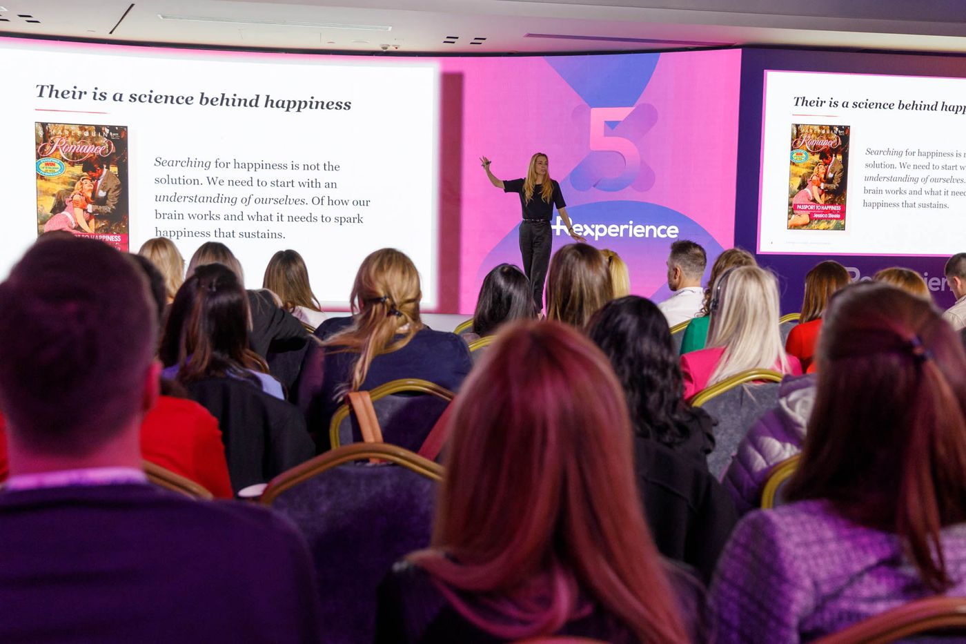 Astrid Groenewegen on stage at HRexperience in Belgrade, seen from the packed auditorium
