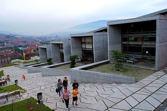 The Medellín Metrocable running above the hillside settlements — the cable car that connected isolated communities to the rest of the city