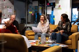 People connecting in a relaxed setting — the kind of interaction that happens when people feel safe enough to reach out
