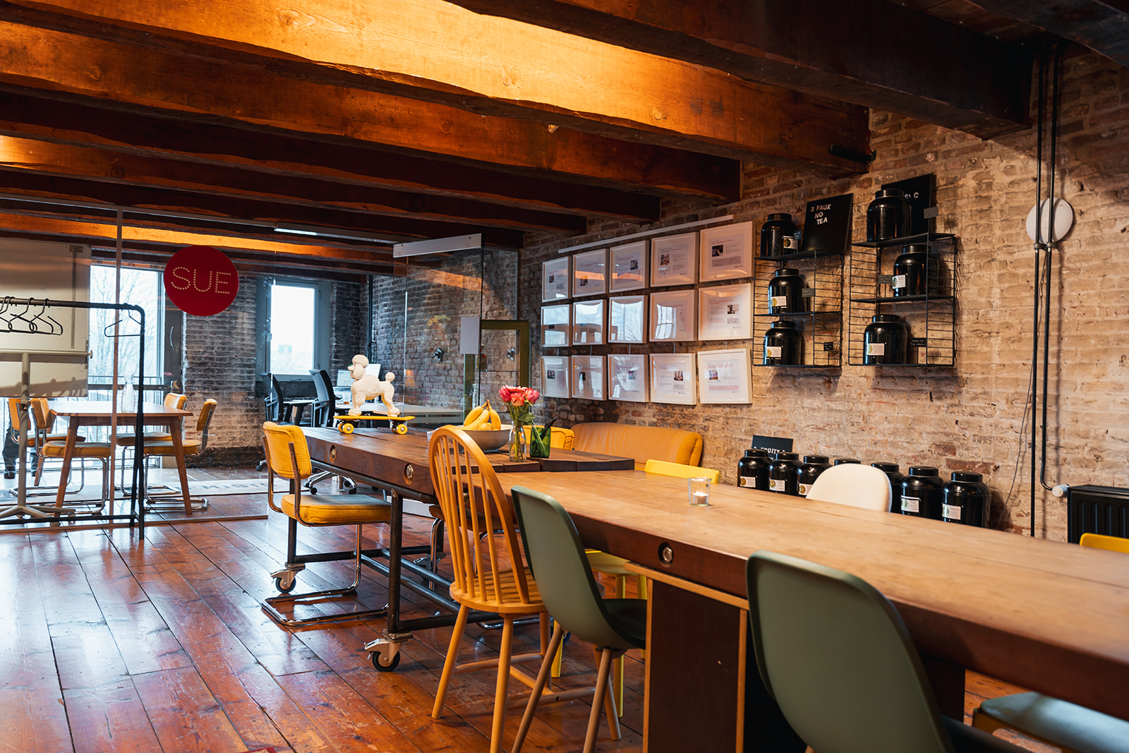 The SUE office in Amsterdam — an open workspace with character, mixed furniture and distinct zones