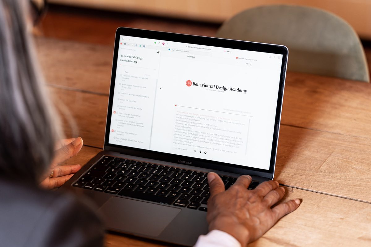A learner following the online Behavioural Design Academy on a laptop