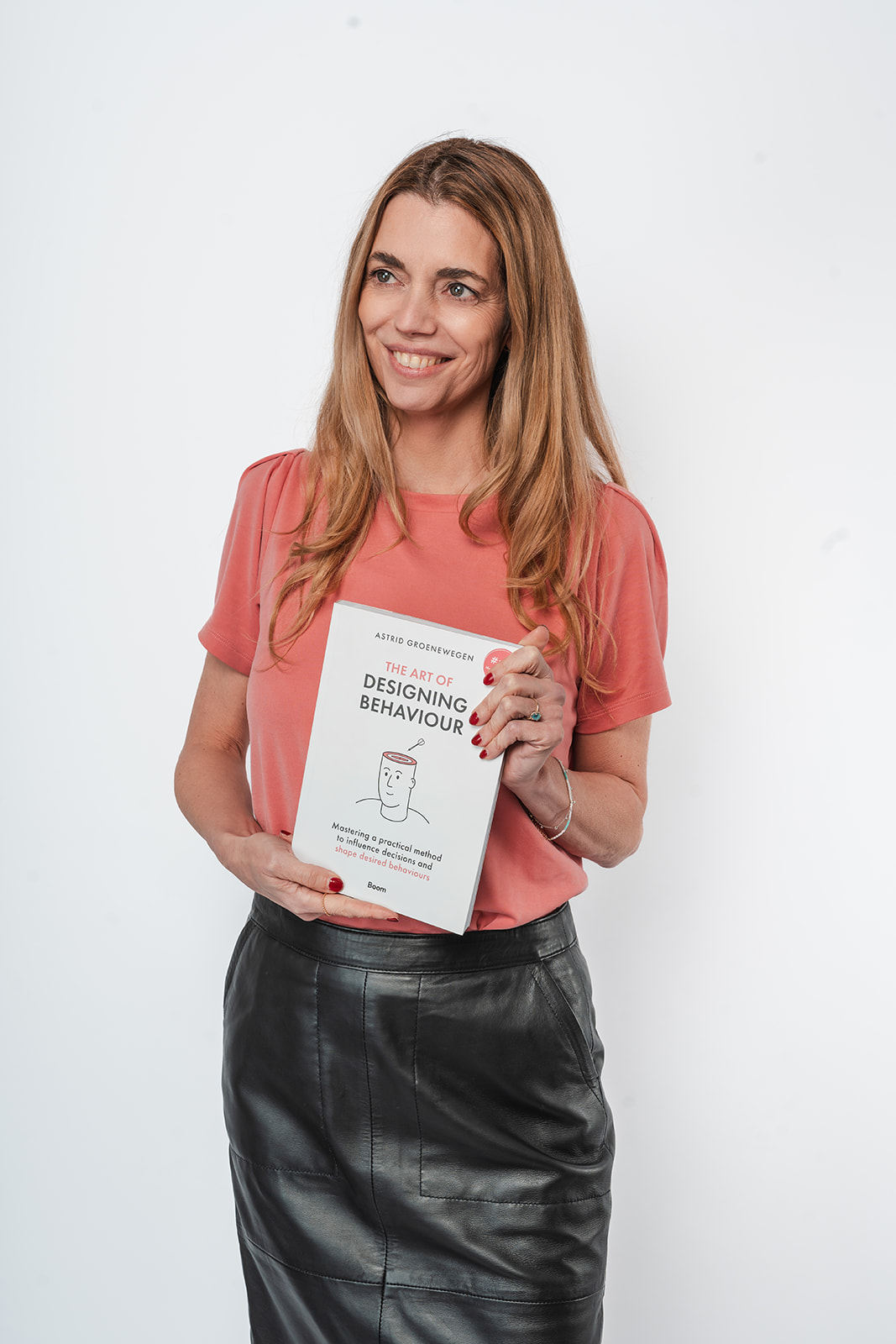 Astrid Groenewegen with her book The Art of Designing Behaviour