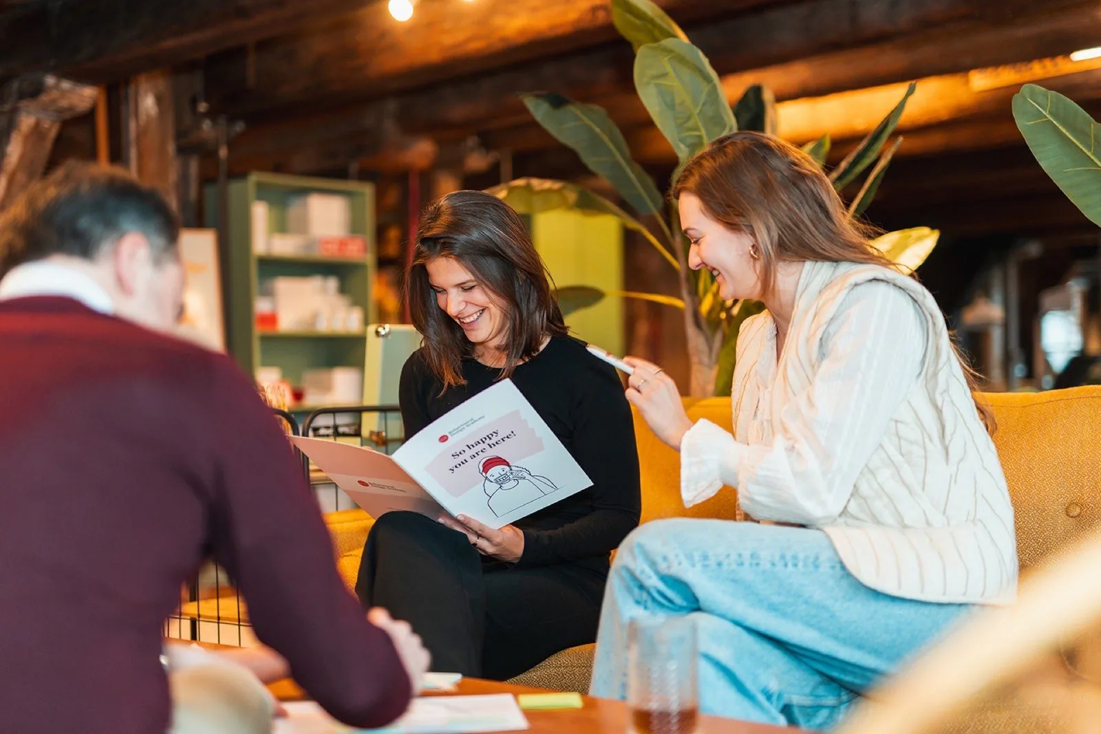 A participant laughs during a conversation in the training The Art of Influence© in Amsterdam